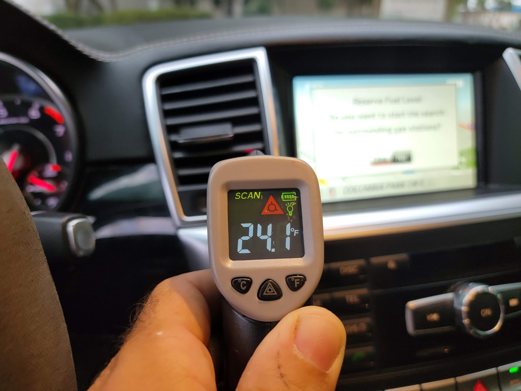 Infrared thermometer reading inside a vehicle cabin